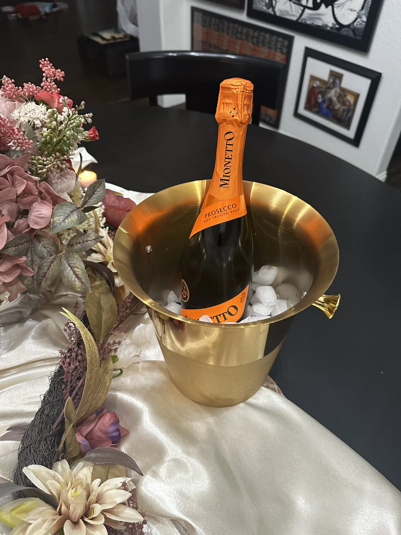 Champagne presentation nestled in an elegant floral tablescape